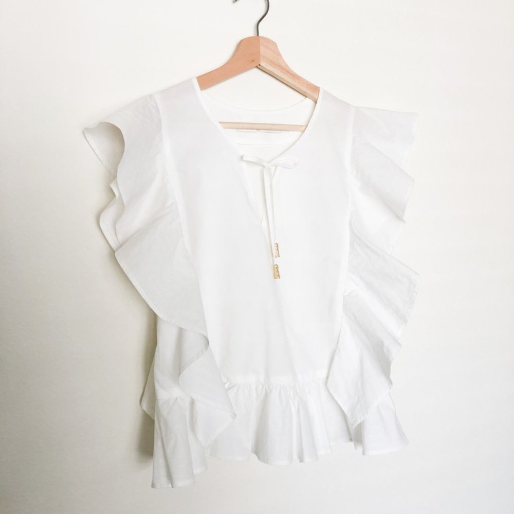 Marie Oliver White Ruffle Blouse with Gold Tassel